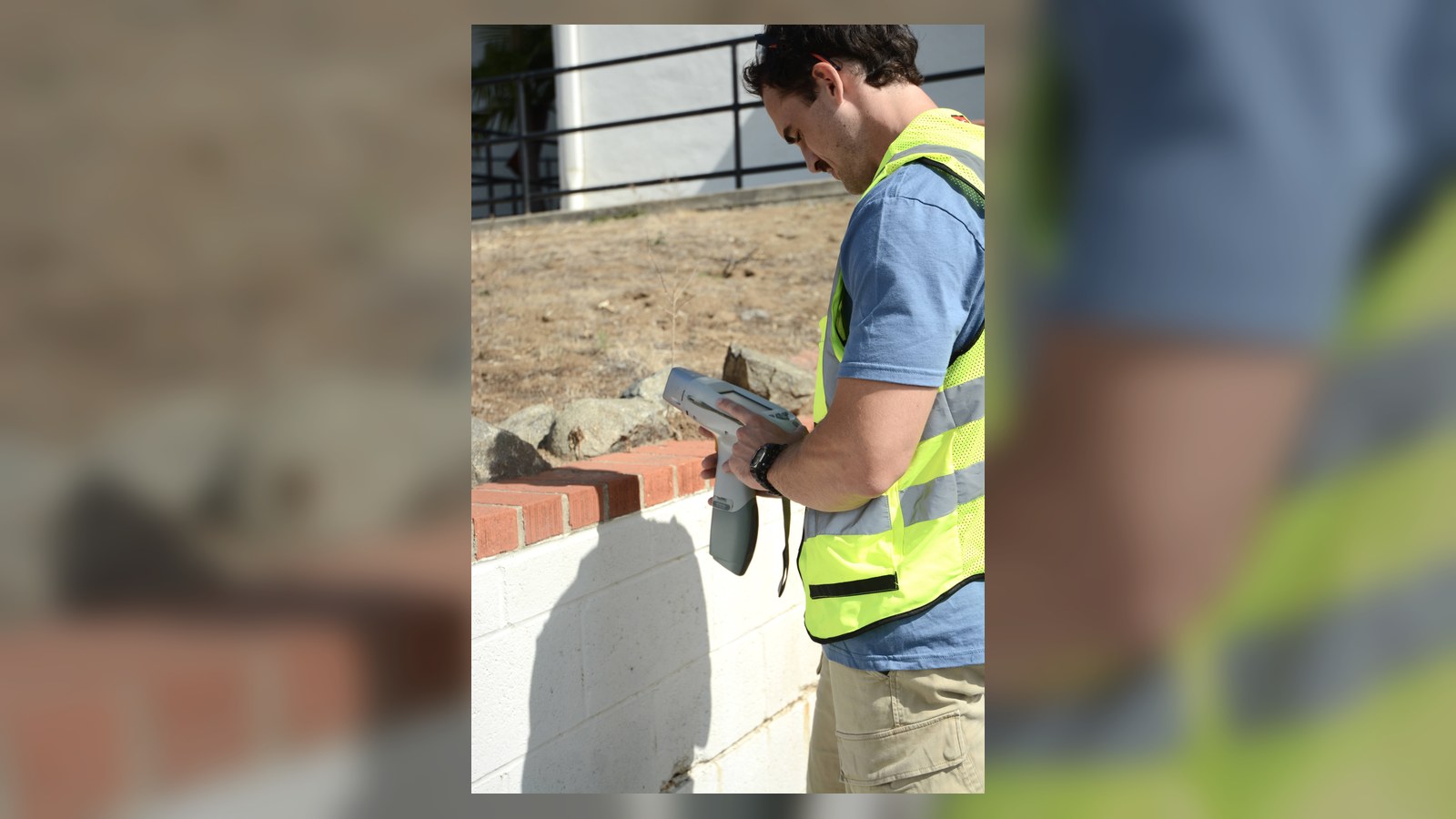 XRF Research technician using an XRF instrument outdoors