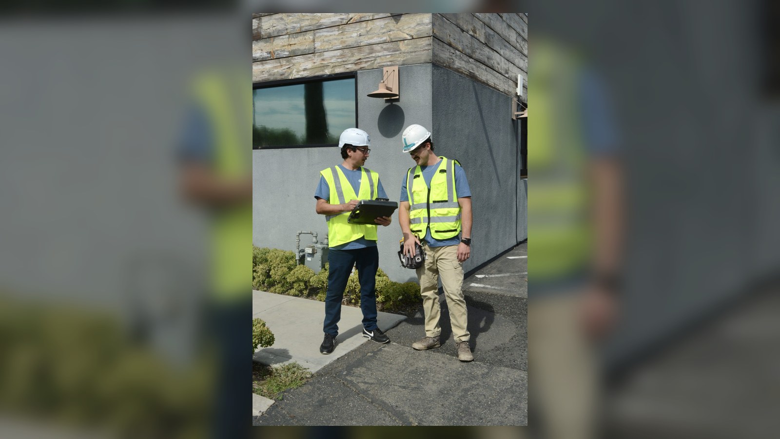 XRF Research field team discussing asbestos testing outside a building